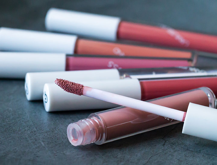 various shades liquid lipsticks lying display tubes