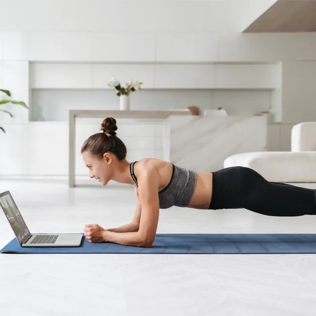 "Woman in plank position during Pilates"
