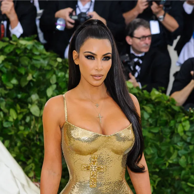 Kim Kardashian attending a celebrity event with a glamorous look.