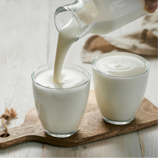 kefir being poured into glasses