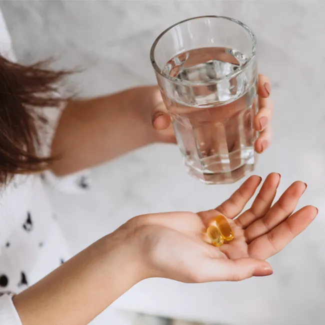 Vitamin D supplement with sunlight and healthy lifestyle imagery.