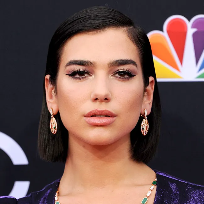 "Dua Lipa posing for a photo"