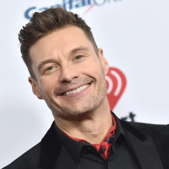 Ellen DeGeneres smiling at a public event, exuding positivity.