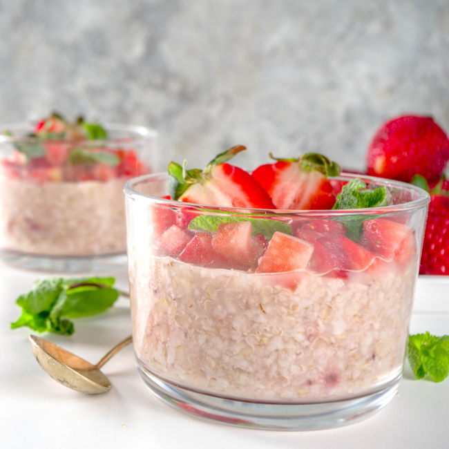 strawberry overnight oats in a glass container