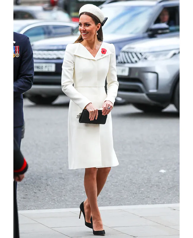 Kate Middleton in elegant white dress at Thanksgiving event.