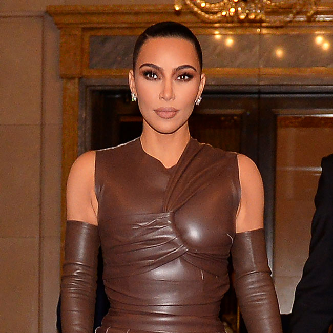 Kim Kardashian wears huge orange puffer jacket on date night with