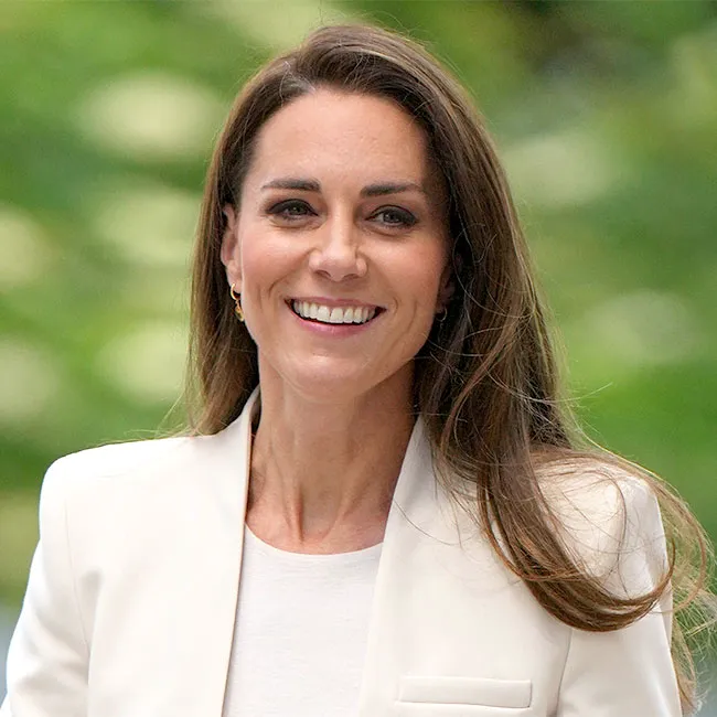 Kate Middleton posing gracefully in her fashionable attire