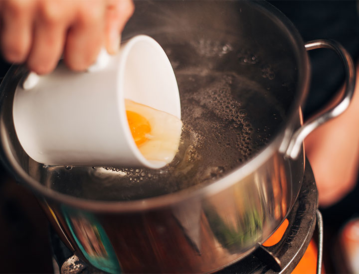 Poaching egg.