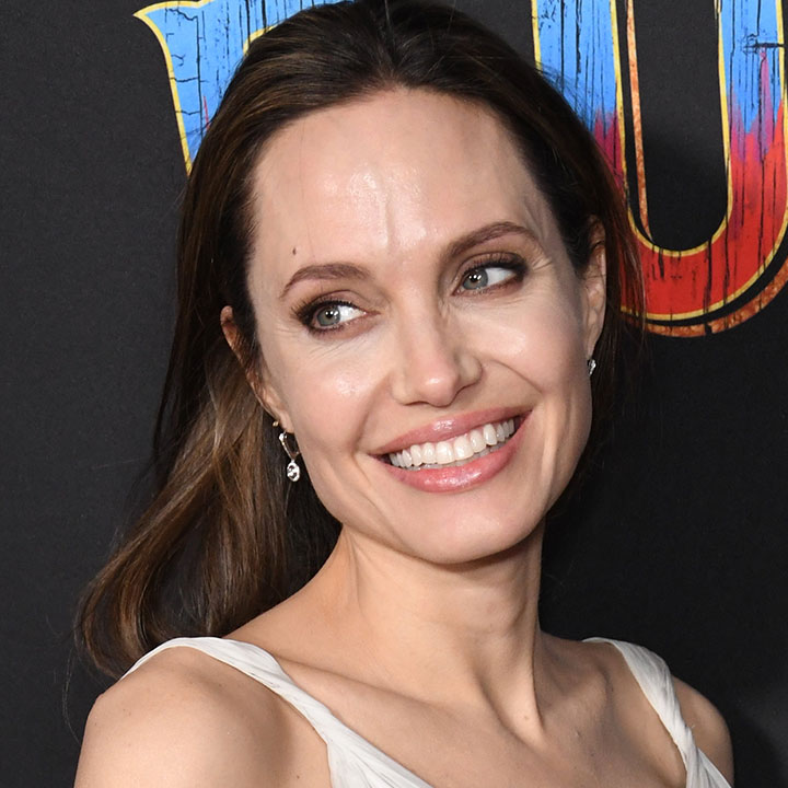 Angelina Jolie Gives A Rare Street Style Look In A White Wrap Dress Amid  Brad Pitt Drama - SHEfinds