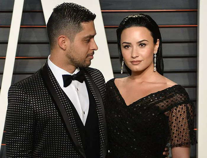 Demi Lovato and Wilmer Valderrama at a red carpet event