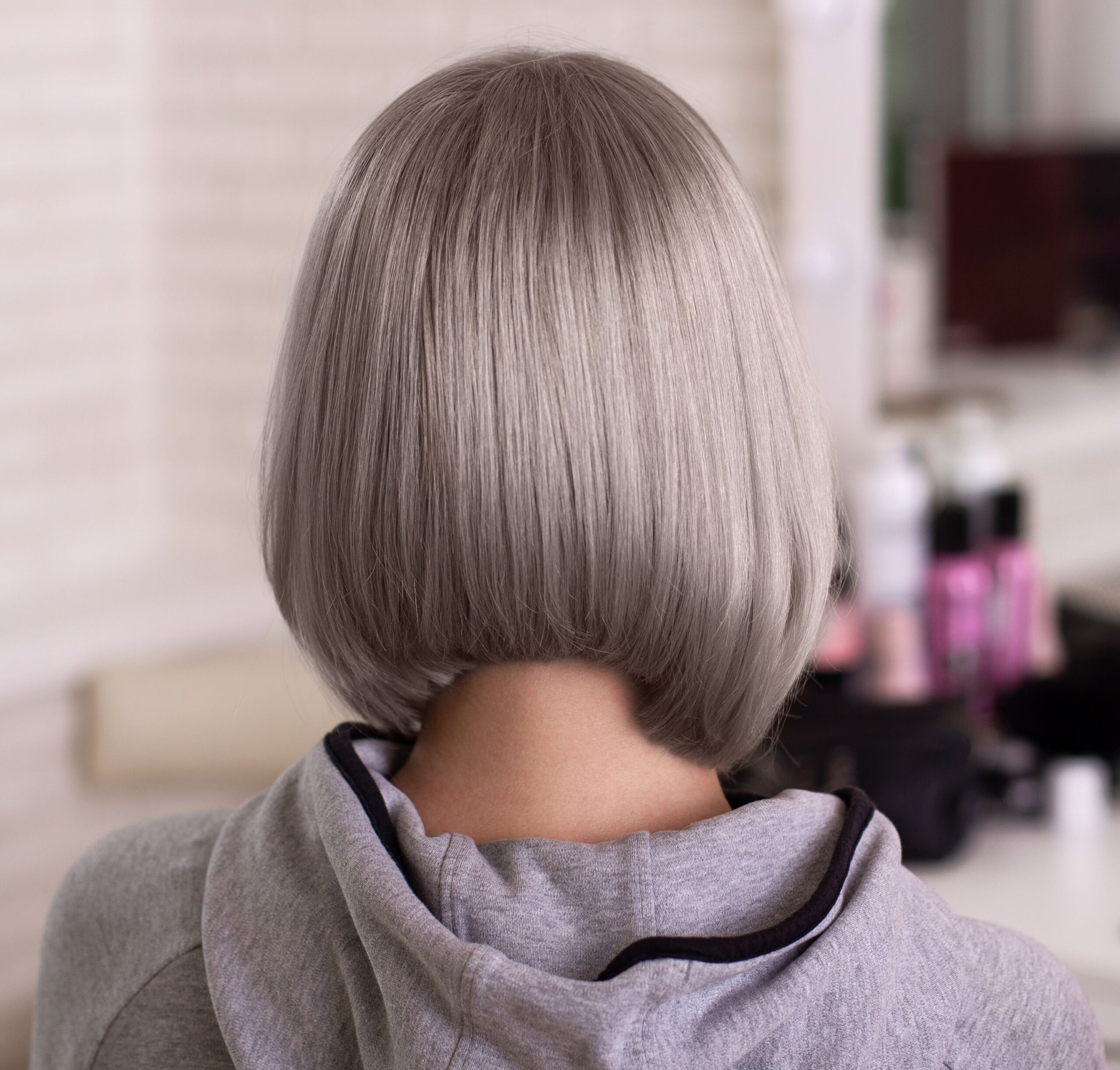 gray sleek bob from behind salon shot haircut