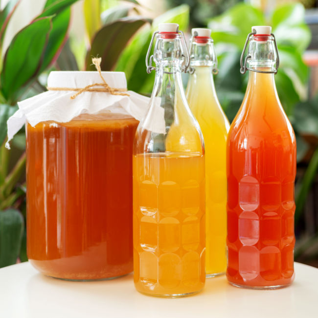 kombucha in bottles and jar