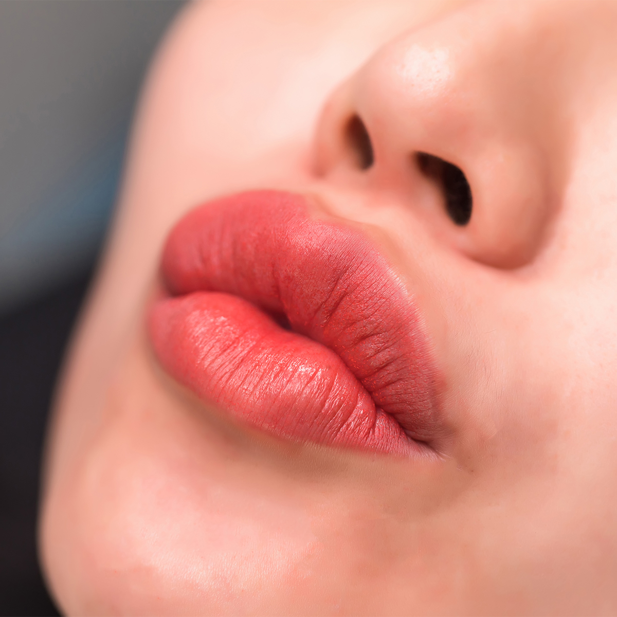 plump kissy face red lips close-up shot