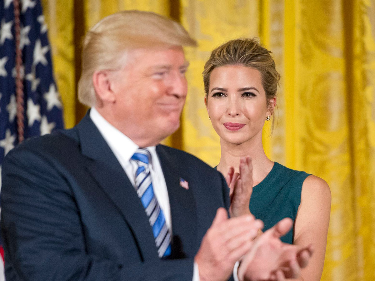 donald trump blue tie ivanka trump standing in background applauding