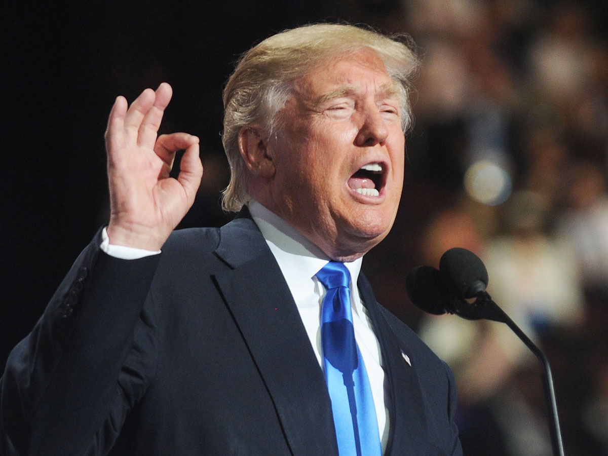 donald trump talking hand gesture