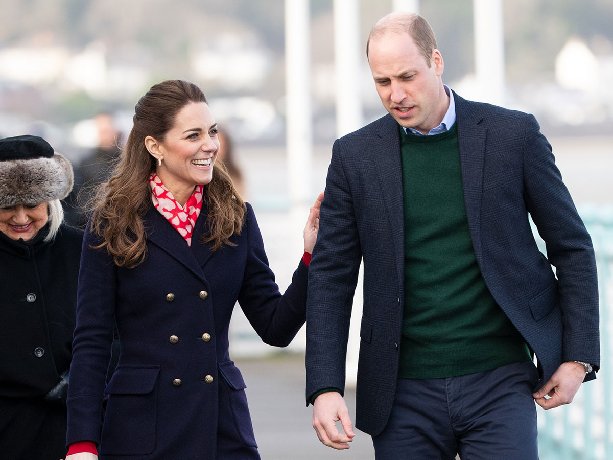 prince william kate middleton long navy coat red scarf royal national lifeboat institution