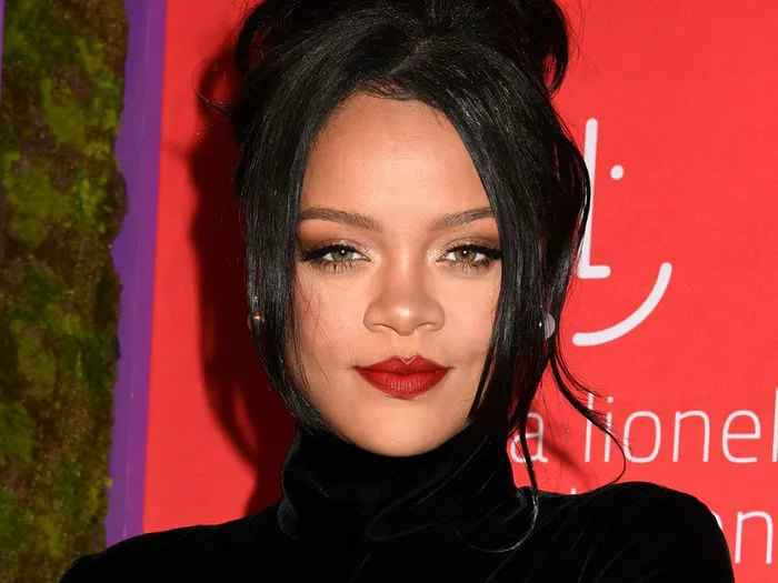 rihanna close up hair up red lipstick