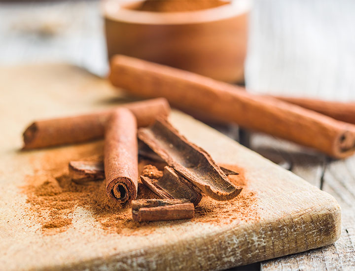 Cinnamon sticks on a board