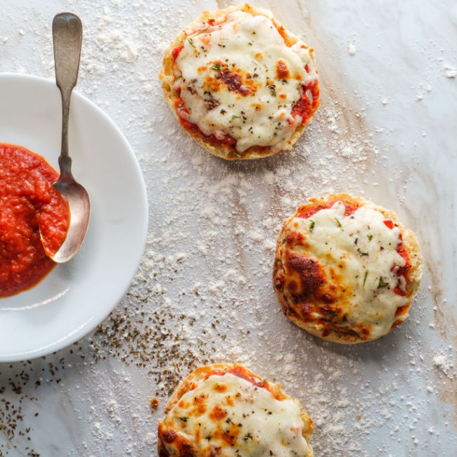 english muffins topped with pizza sauce and cheese