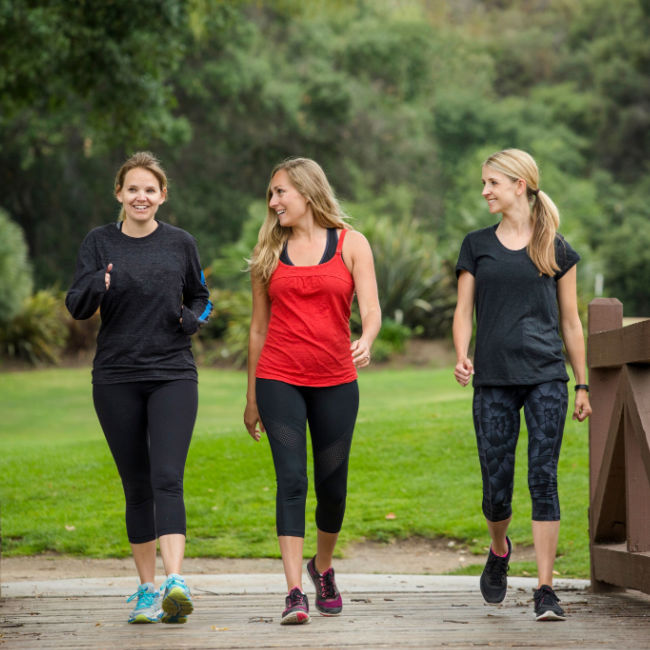 three women walking outside