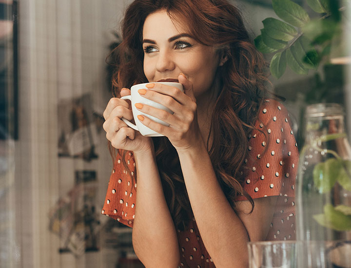 Woman enjoying a cup of coffee