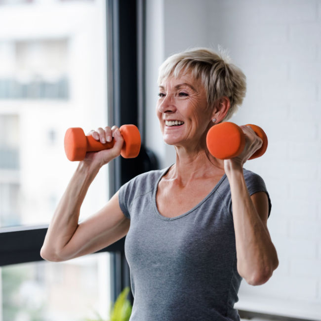 older woman lifting weights