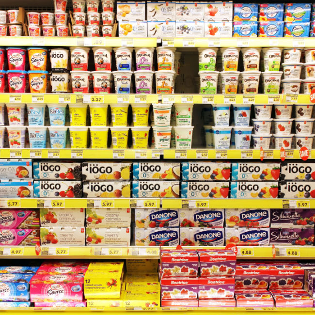rows of yogurt in grocery store