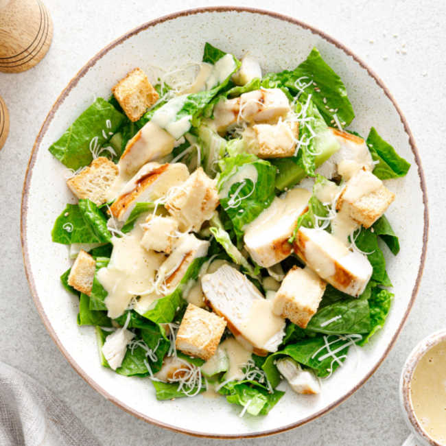 chicken caesar salad in bowl