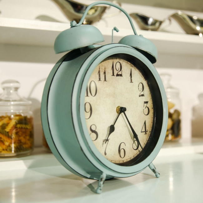 blue analog clock on kitchen counter