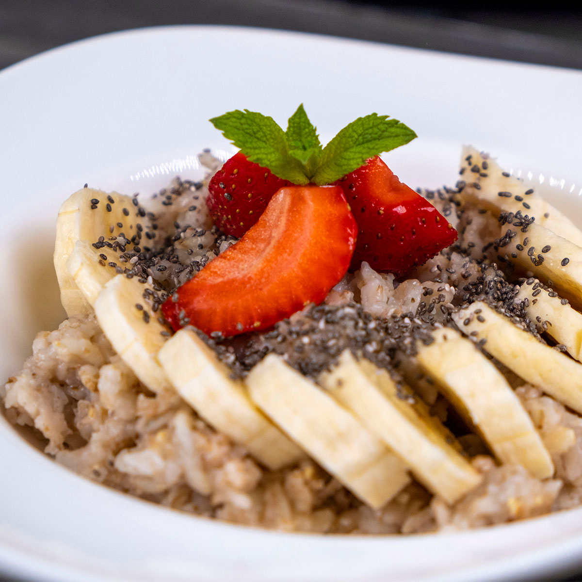 oatmeal topped with berries, chia seeds, and banana