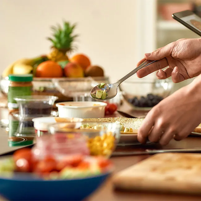 meal planning and prepping wooden cutting board to go boxes