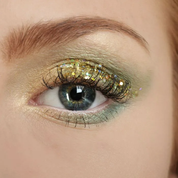 woman with sparkly eyeshadow around eye subtle wrinkles