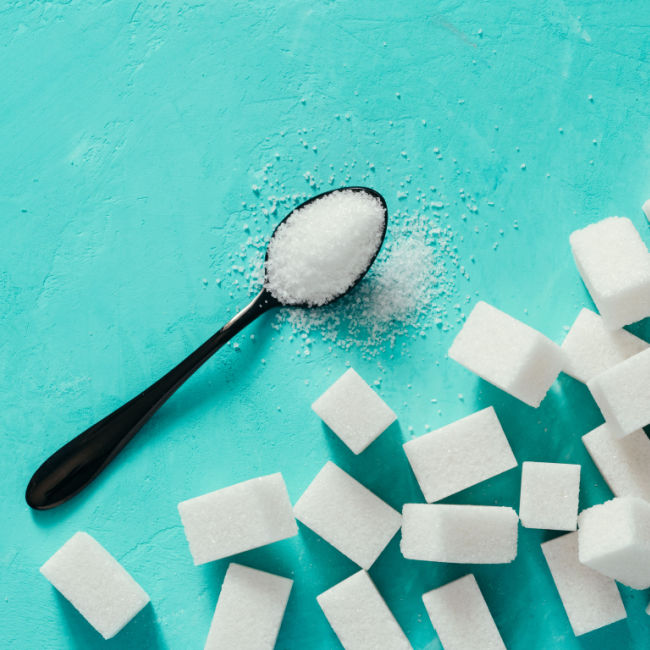 spoonful of sugar beside sugar cubes