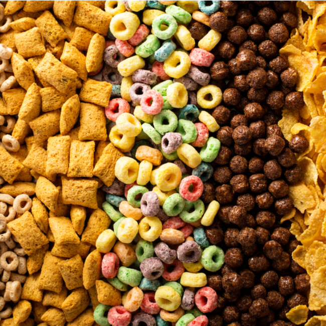 close up of various breakfast cereals like captain crunch, fruit loops, and cocoa puffs