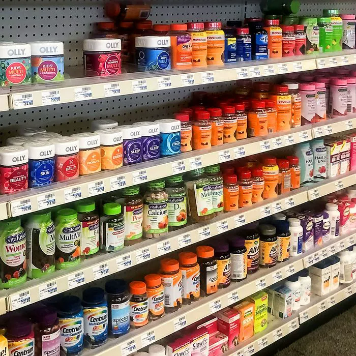 Assorted vitamins and supplements at a drugstore shelf