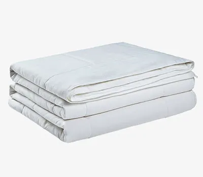 Soft and cozy Ettitude bamboo comforter in natural tones.