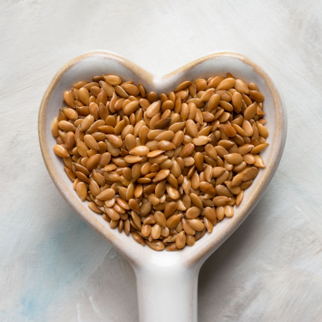 flaxseeds in heart-shaped scoop