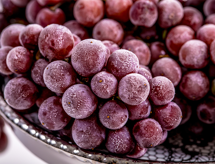 Frozen purple grapes
