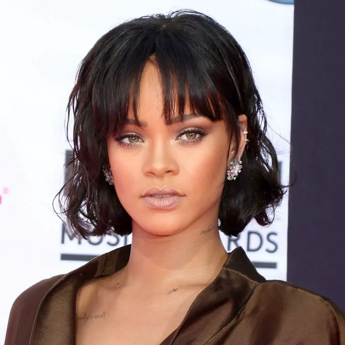 "Rihanna with a wavy bob and wispy bangs on the red carpet"