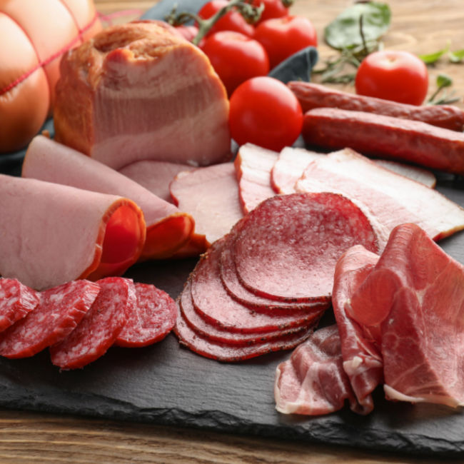 tray of various deli meats like salami, ham, sausage