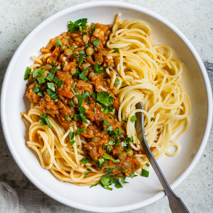 plateful of legumes on spaghetti