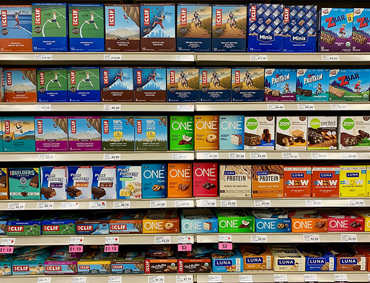 Rows of protein bars at the grocery store.