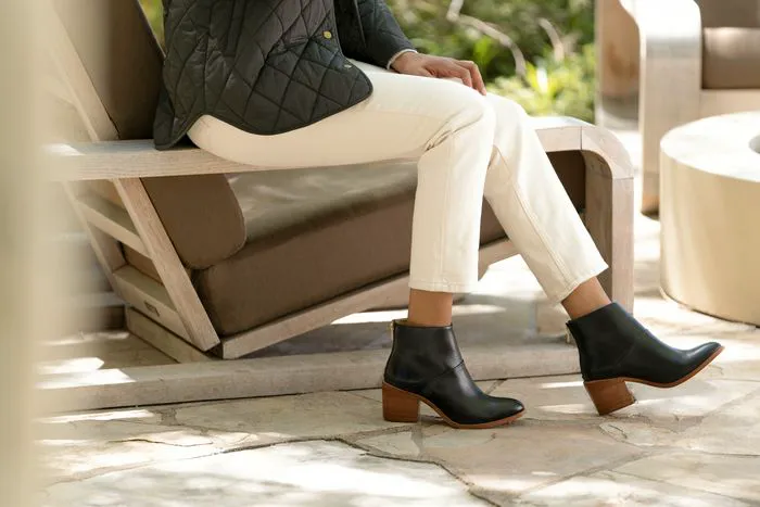 Stylish model showcasing FW22 colorway footwear collection.