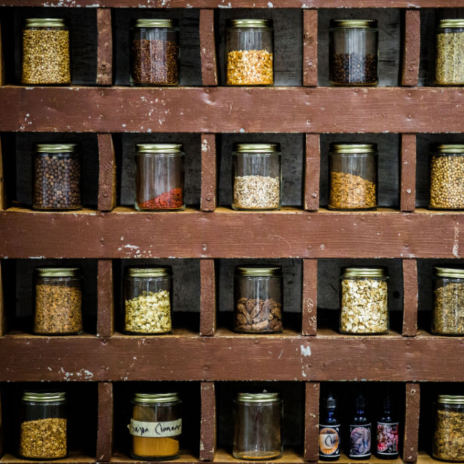 wall of various spices in small jars