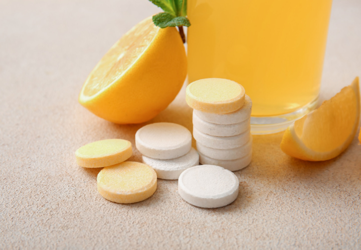 Vitamin C supplements near orange