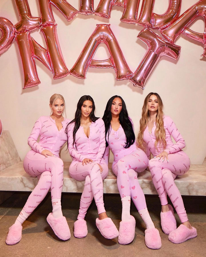 Kim Kardashian wearing skims pink pajamas click to shop