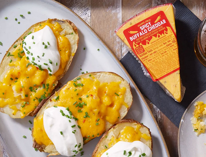 trader joe's spicy buffalo cheddar beside cheese toast