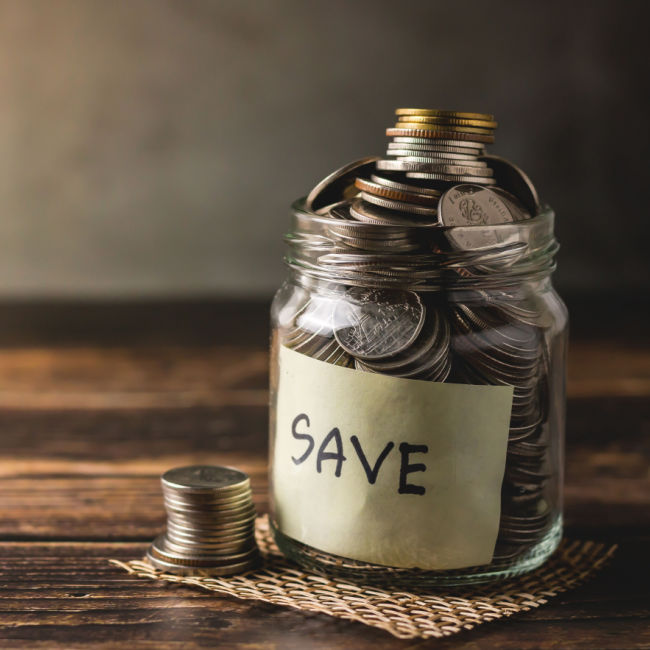 jar filled with coins and marked 