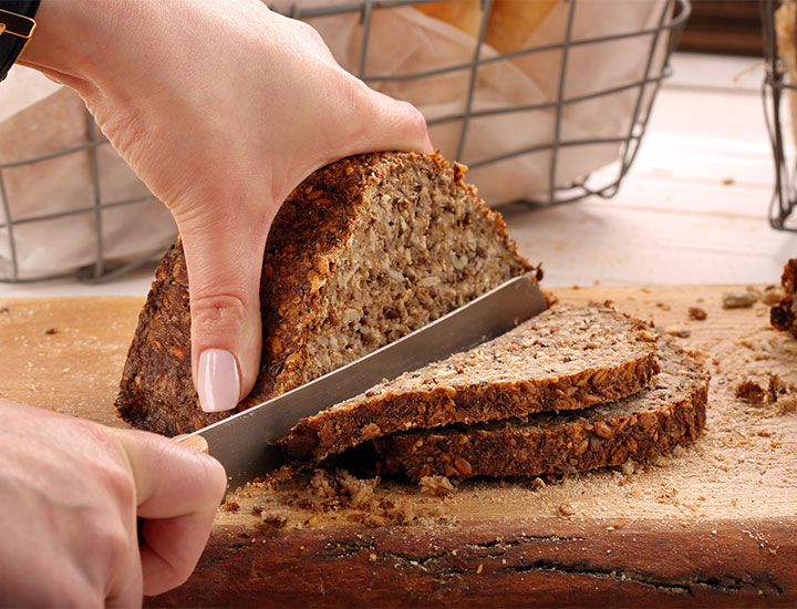 Cutting into whole grain bread