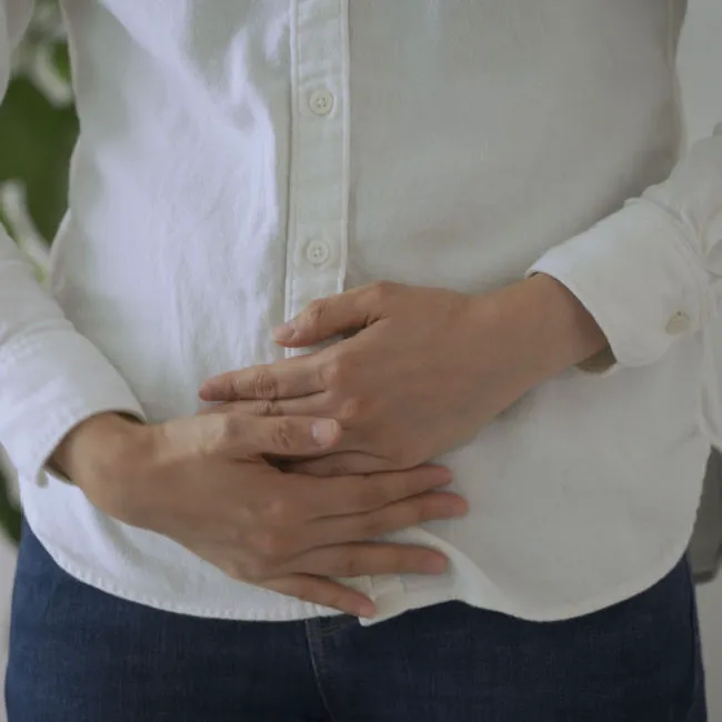 person holding stomach